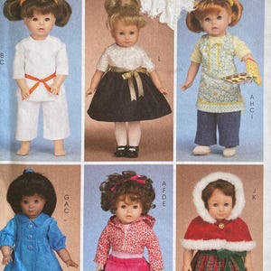 May include: A McCall's Crafts sewing pattern, M6006, featuring doll clothing designs. The pattern includes various outfits, such as a white outfit, a black skirt with a white top, and a red and green plaid dress with a white fur-trimmed hood.