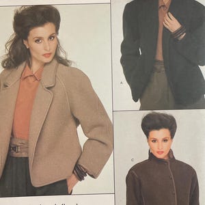 May include: Vogue Patterns American Designer sewing pattern featuring Calvin Klein designs. The pattern includes images of a woman wearing a tan blazer, a dark green jacket, and a brown button-up jacket. The pattern number is 2811.