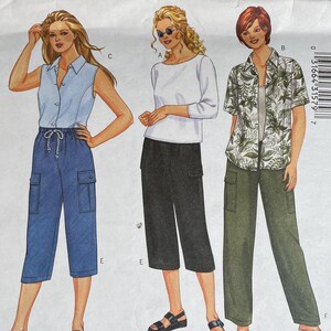May include: A Butterick sewing pattern envelope featuring illustrations of women's clothing. The designs include a long-sleeved top and shorts, a sleeveless shirt and capri pants, a three-quarter sleeve top and capri pants, and a short-sleeved shirt and long pants.