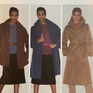 May include: A vintage McCall's sewing pattern for a coat, featuring three models wearing different versions of the coat. The pattern number is 6775, and the size is Miss Size Medium. The pattern is titled "Make It Tonight, Wear It Tomorrow!" and is priced at £2.25.