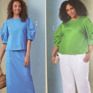 May include: A sewing pattern package featuring two women modeling different outfits. The package is labeled "Butterick" and includes the style number B7002. One woman wears a blue top and skirt, the other a green top and white pants. The package also includes size information.