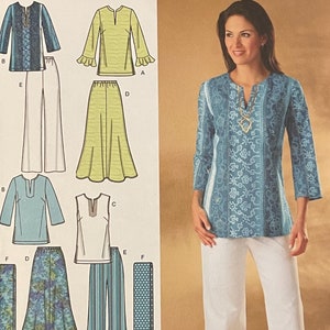 May include: A sewing pattern for a women's top and pants. The pattern includes a blue and white floral print top, a white top, a green skirt, a white pair of pants, a blue and white striped pair of pants, and a blue and white polka dot pair of pants. The pattern is for sizes 10, 12, 14, 16, and 18. The pattern is from Simplicity and is easy-to-sew.