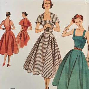 May include: Vogue Patterns sewing pattern featuring illustrations of vintage dresses. The cover includes the text "V2002" and "REISSUE CIRCA 1952 DESIGN." The pattern includes size options and cutting layouts. The design is printed in the USA.