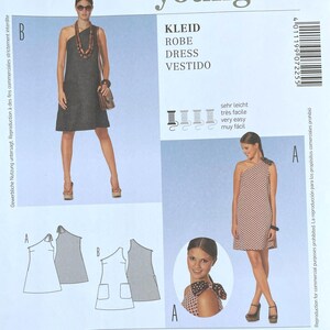 May include: A Burda Young 7225 sewing pattern envelope featuring two dress variations. One is a solid dark dress, the other a patterned dress with a shoulder tie. Includes EUR sizes 32-44 and US sizes 6-18, with text indicating very easy construction.