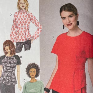 May include: A Butterick sewing pattern envelope, B6375, with illustrations of four blouse designs. The main image shows a woman in a red short-sleeved top. The envelope includes text and a barcode.