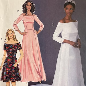 May include: Butterick sewing pattern B6639 featuring three dress designs. One is a short, floral print dress, another is a long, pink gown, and the third is a white, off-the-shoulder wedding dress with a long train.