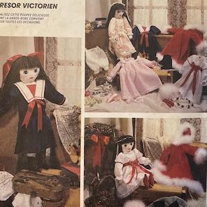 May include: A vintage McCall's Crafts sewing pattern for a Victorian treasure, featuring a stuffed doll and clothing designs. The pattern includes images of dolls in various outfits, including a sailor dress and a red and white Christmas-themed ensemble.