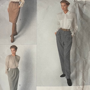 May include: A vintage Vogue sewing pattern for a skirt and pants by Calvin Klein. The pattern is for sizes 6-14 and is rated easy to sew. The pattern number is 2392.