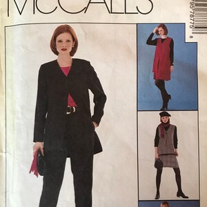 May include: McCall's sewing pattern for a women's suit. The pattern is for sizes 20, 22, and 24. The pattern is called "Select-A-Size" and allows you to choose different sizes for tops and bottoms. The pattern is part of the Woman's Day Collection.