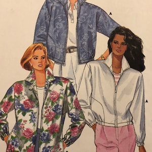 May include: A sewing pattern for a jacket with three different designs. The first design is a blue denim jacket, the second is a white jacket with a floral print, and the third is a white jacket in a solid colour. The pattern is from Butterick and is labelled "Fast & Easy".