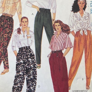 May include: A McCall's sewing pattern envelope for pants, labeled 5054, size Small, Petite. The front displays illustrations of five different outfits featuring various styles of high-waisted pants paired with blouses, including floral, solid, and striped designs.