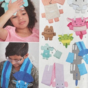 May include: Simplicity sewing pattern S9811 showing designs for stuffed animals, such as elephants, bears, and dragons. The pattern includes instructions for making items like a neck wrap and a head wrap. The text "easy-to-sew" is visible.