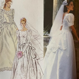 May include: Simplicity sewing pattern for a wedding dress. The pattern includes three different styles of dresses, all with lace details. The pattern number is 39363 and the size is D (4-8).
