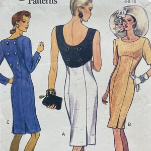 May include: Vogue Patterns sewing pattern with illustrations of three dress designs in blue, white, and yellow. The pattern includes sizes 6-8-10. The Vogue logo is at the top left. The barcode and pattern number are visible at the bottom.