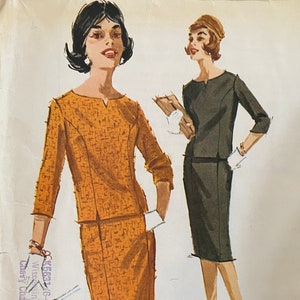 May include: Vintage McCall's sewing pattern for a two-piece dress, size 14, bust 34. The pattern features a black and white illustration of two women wearing the dress, one in a brown and white print and the other in a solid black.