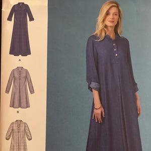 May include: Simplicity sewing pattern S8983 H5 featuring a denim-style dress with long sleeves and a button-down front. The pattern includes variations with different sleeve and collar styles. Size U.S. 6-14.