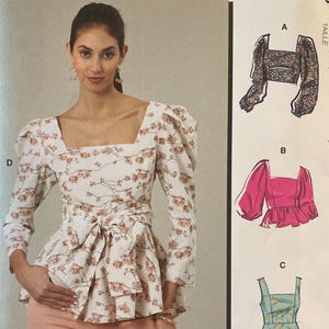 May include: McCall's sewing pattern featuring a square-neck top with puff sleeves and a peplum, with a floral print. The pattern includes multiple view options. The size is F5 (16-18-20-22-24). Designed and printed in the USA.