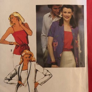 May include: Simplicity sewing pattern number 9416 for a women's top and jacket. The pattern includes three different styles: a sleeveless top with a tie at the waist, a short-sleeved top with a scoop neck, and a jacket with a shawl collar. The pattern is for size 10 miss.
