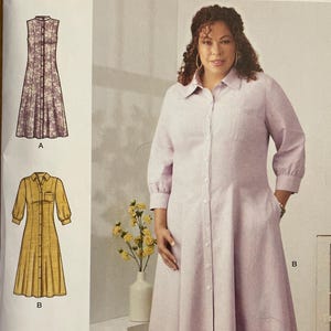 May include: Simplicity sewing pattern S9260. The pattern features three dress designs: a floral print dress, a yellow dress with a pocket, and a red dotted dress. The pattern includes sizes 20W-28W.