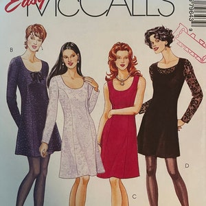 May include: A sewing pattern for a dress, featuring four different styles. The pattern is called "Easy McCall's" and the pattern number is 7964. The pattern is for sizes 12, 14, and 16. The pattern is labeled "Petite-Able".