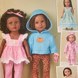 May include: Simplicity sewing pattern S3059 for 18-inch dolls. The pattern features doll clothing designs, including a pink outfit, a blue hoodie with leopard print pants, and other outfits. The pattern is designed and printed in the USA.