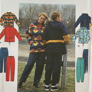 May include: Simplicity sewing pattern number 8322 for jackets and pants. The pattern includes three different styles: a jacket with a geometric pattern, a solid jacket, and a jacket with a floral pattern. The pattern also includes two different styles of pants: one with a drawstring waist and one with a regular waist.