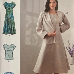 May include: Simplicity sewing pattern S9263. The pattern includes designs for a dress, top, and jacket. The dress is shown in a green and blue floral print. The jacket and dress are a light beige colour. The pattern size is U.S. 6-14.