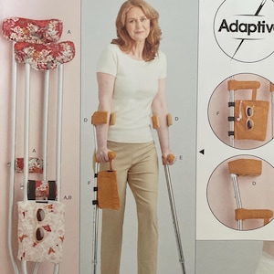 May include: Simplicity pattern S9724 featuring adaptive crutch accessories. The pattern includes designs for crutch pads, hand grips, and foot covers. The image shows a woman using crutches with the accessories.