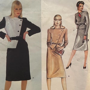 May include: A vintage sewing pattern for a skirt suit by Christian Dior. The pattern features three different styles, including a black and white skirt suit, a brown skirt suit, and a gray skirt suit. The pattern number is 2470.