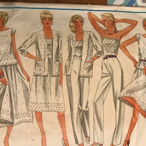 May include: A vintage sewing pattern for Vogue's Basic Design, featuring five different styles of women's clothing. The pattern number is 2687.