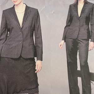 May include: A Vogue pattern for a Bill Blass suit, featuring a pinstripe blazer, skirt, and pants. The pattern includes sizes 18-20-22. The image shows a woman wearing the suit. The text "BILL BLASS" and "VOGUE AMERICAN DESIGNER" are visible.