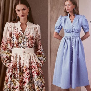 May include: Vogue Patterns sewing pattern featuring two dress designs. One dress is a floral print with long sleeves and a button-down front. The other is a solid light blue dress with short sleeves and a button-down front. The pattern size is Y5 (18-20-22-24-26).