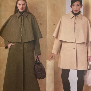 May include: Vogue Patterns V2074 sewing pattern featuring two coat designs with capes. One coat is olive green, the other is beige. The pattern includes sizes S-XXL. The Vogue logo is at the top.
