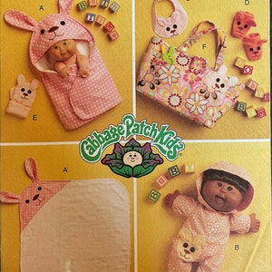 May include: A sewing pattern for Cabbage Patch Kids clothing. The pattern includes instructions for making a bunny hooded blanket, a bib, a diaper bag, booties, and a sleeper. The pattern is for one size.