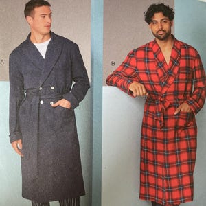 May include: Vogue Patterns sewing pattern V1855. The pattern features two long robes, one in a solid navy blue and the other in a red and black plaid. The pattern size is MXX (40-42-44-46).