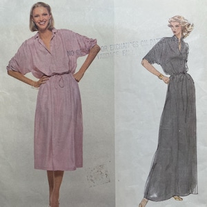 May include: Vintage Vogue American Designer sewing pattern featuring two dress designs. The pattern includes a pink dress and a gray dress. The pattern is labeled "1880" and designed by Carol Horn.