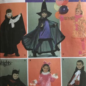 May include: Simplicity Costumes for Kids sewing pattern featuring various Halloween costume designs. The image shows children dressed as a vampire, witch, bat, and other characters. The pattern includes sizes 3, 4, 5, 6, 7, and 8.