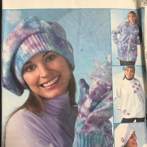 May include: McCall's sewing pattern for a fleece jacket, hat, and mittens. The pattern is called "Fabulous Fleece" by Nancy Cornwell. The pattern includes a blue and purple tie-dye design.