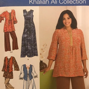May include: Simplicity sewing pattern featuring the Khaliah Ali Collection. The pattern includes designs for a tunic and pants set, a sleeveless dress, and other separates. The model is wearing a peach-colored tunic and brown pants. The pattern size is GG 26W-32W.