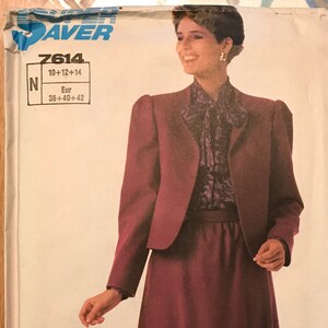 May include: A sewing pattern envelope for a two-piece outfit featuring a maroon jacket and a matching midi-length skirt. The pattern is labeled Super Saver 7614, with sizes 10, 12, 14 and European sizes 38, 40, 42 printed on the front cover.
