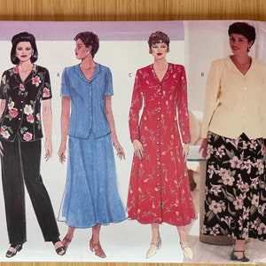 May include: A sewing pattern for a dress and jacket with a floral print. The pattern is from Butterick and is designed by Delta Burke. The pattern number is 4875.