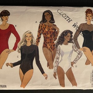 May include: A sewing pattern for four different leotards. The pattern includes a red leotard, a black leotard, a leopard print leotard, and a white leotard with lace sleeves. The pattern is from Butterick Classics Fast & Easy and is size 6-8-10.
