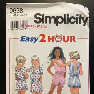 May include: Simplicity sewing pattern number 9638 for girls' clothing sizes 5, 6, 7, and 8. The pattern includes three different outfits: a floral print top and shorts, a striped top and shorts, and a pink tank top and shorts. The pattern is labelled "Easy 2 Hour" and features a clock with a red face and black hands.
