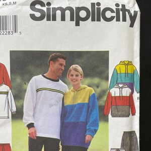 May include: Simplicity sewing pattern number 430 for sizes XS, S, and M. The pattern includes instructions for making a hooded sweatshirt, a long-sleeved shirt, and sweatpants. The pattern is illustrated with a model wearing the finished garments.