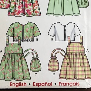 May include: A sewing pattern for a child's dress and matching bag. The pattern includes three different styles of dresses, all with a gingham, floral, or plaid print. The pattern is for sizes 3-8 and is from Simplicity.