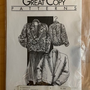 May include: A sewing pattern for a blanket jacket. The pattern is from Great Copy Patterns and is number 805. The pattern shows a jacket with a floral print and a jacket with a fuzzy texture. The pattern is $8.00.