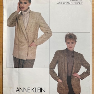May include: Vogue Patterns American Designer sewing pattern featuring an Anne Klein design. The pattern shows a double-breasted blazer in a tweed-like fabric. The pattern number is 2985.