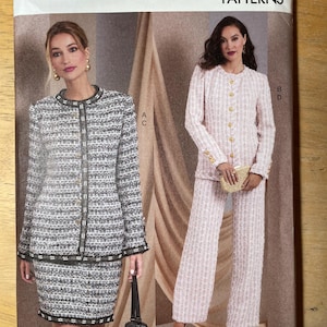 May include: Vogue Patterns sewing pattern showing two tweed suits. One is a black and white skirt suit, and the other is a pink trouser suit. The pattern number is V1992, and the size is B5 (8-10-12-14-16).