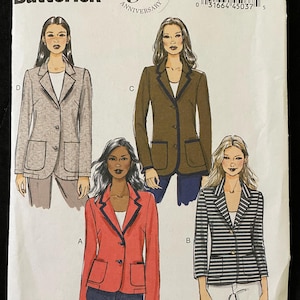 May include: Butterick B5926 sewing pattern featuring four blazer designs. The blazers include a gray tweed, a brown blazer with navy trim, a red blazer with black trim, and a striped blazer. The pattern celebrates Butterick's 150th anniversary.