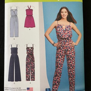 May include: A sewing pattern for a jumpsuit with three different styles. The pattern is from Simplicity and is easy-to-sew. The pattern includes a floral print jumpsuit, a striped jumpsuit, and a solid pink dress.